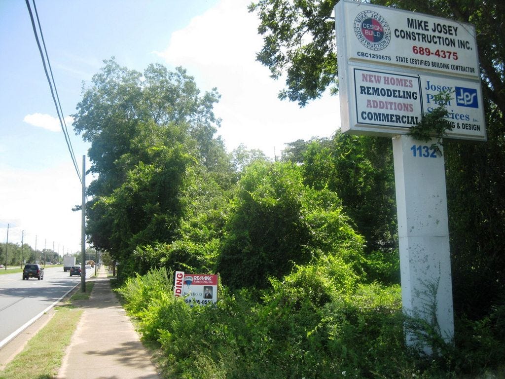 The wooded lot on the right, beyond the Josey Construction sign, is the site of planned third Waffle House for Crestview.