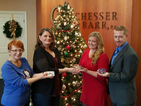 Special to the News Bulletin

The local Guardian Ad Litem program and the teenagers it represents have $1,740 this Christmas with donations from Chesser and Barr PA staffers. Pictured, from left, are Deborah Tipton, who led the program all year; Lisa Brown, GAL representative; Emily L. Rogers, real estate closing attorney; and Brian W. Corlew, family law attorney.