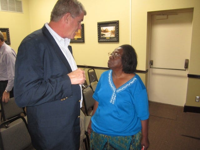 Community activist Mae R. Coleman expresses her support for a proposed shopping mall in Crestview with developer Bob Peck following a city council workshop Tuesday evening.