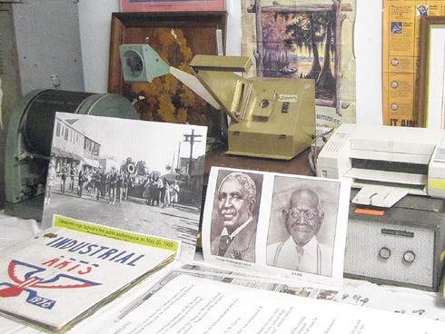 Among vintage school equipment at Carver-Hill Museum are photos of the Carver Hill School band’s Main Street performance and school namesakes George Washington Carver and Ed Hill.