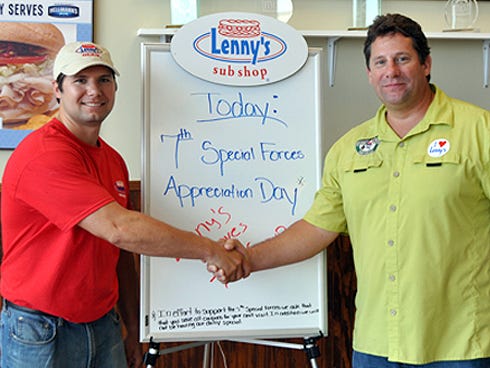 Andrew Sheriff, the Crestview Lenny's Sub Shop owner, shakes hands with Special Forces Association Chapter 7 president Steven Tuttle. The restaurant donated $720 of Friday’s sales to the association, which helps the group’s needy soldiers and their families.