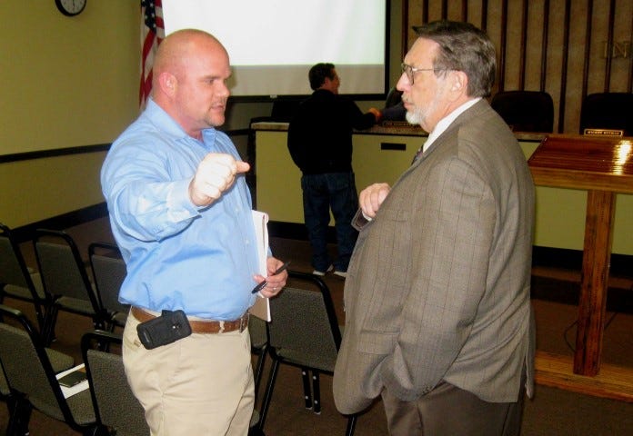 Crestview's new city GIS mapping analyst, Jeff O'Daniels, seen talking with Mayor David Cadle, right, plans to map the city's infrastructure, such as drainage, bridges and pipelines.