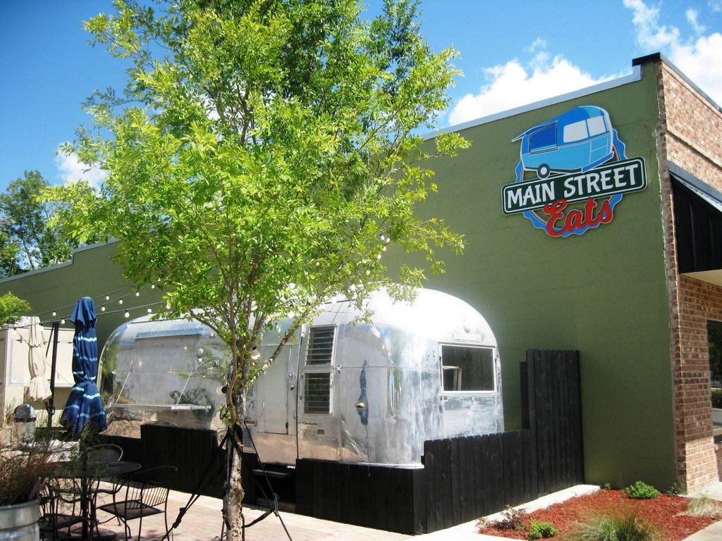 The city initially denied a permit for this sign overlooking Main Street's outdoor food court. Crestview's code enforcement supervisor said the sign actually hangs off premises; that prompted attorney Nathan Boyles, the property owner, to say the decision showed the city is “unfriendly to business.”