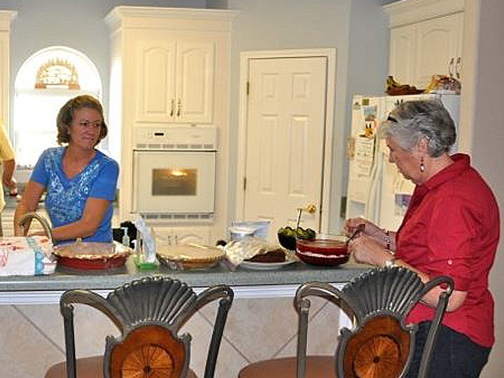 Colleen Barrett, left, and her mother, Diana Weeks, prepare Thanksgiving dinner in 2012. Weeks' mashed potatoes recipe proved a blue ribbon-winner.