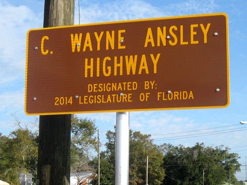 This new sign on the corner at U.S. Highway 90 and Old Bethel Road honors former Okaloosa Assistant Superintendent of Schools C. Wayne Ansley.