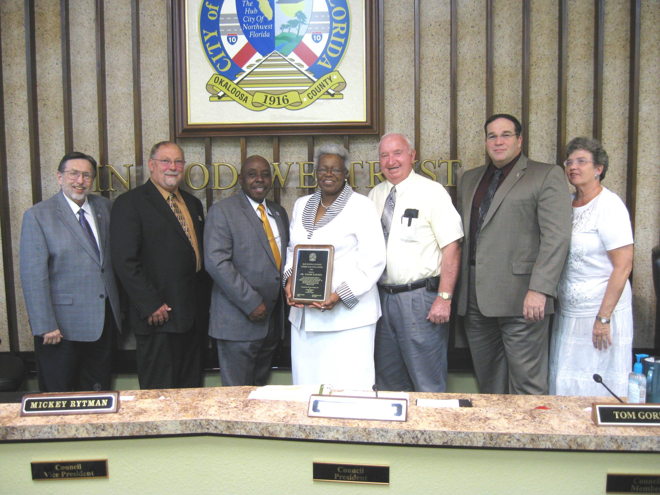 Dr. Naomi Barnes, center right, receives the Mae Reatha Coleman Crestview Citizen of the Year Award. With her, from left, are Mayor David Cadle, Councilman Mickey Rytman, Council President Shannon Hayes, award namesake Coleman, Councilmen Joe Blocker and Tom Gordon, and City Clerk Betsy Roy.
