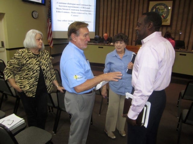 Linda Parker, Cal Zethmayr, Pat Hollarn and David Wheeler, newly appointed members of the CRA advisory committee, converse after Monday's meeting.