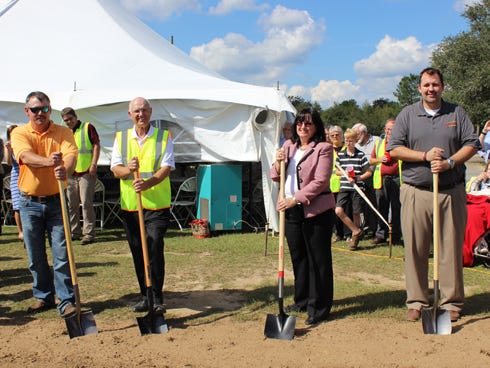 From the left, construction project manager Heath Oglesby, building committee chairman Howard Carr, Coastal Bank representative Karen Donaldson and Rev. Geoff Prows celebrate the planned construction of a new church building with a ground-breaking ceremony for Pilgrim Rest Baptist Church on Oct.12. The Baker church is adding a new sanctuary and classrooms in order to accommodate attendance growth.
