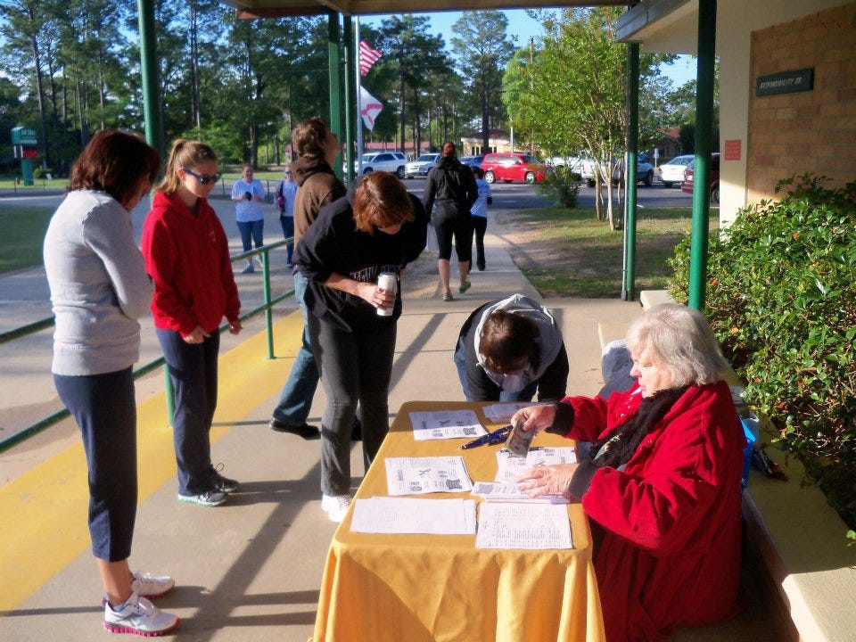 Participants register at last year's Mayor's 5K Walk at Bob Sikes Elementary School. The 5K Walk benefits the Crestview Service Center of the Families First Network of Lakeview on April 12. In addition, residents can support the Shoal River Middle School track team with Annelise's Wild Mustang 5K Run / Walk on the same day.