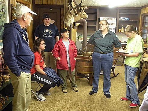 Original Crestview Venture Crew 773 members and former crew adviser LauraJo Hust, second from right, met during spring break 2009 with retired forester John McMahon, left, and Boy Scout area commissioner Rae Schwartz, center, to discuss organizing programs at Crestview’s McMahon Environmental Center.