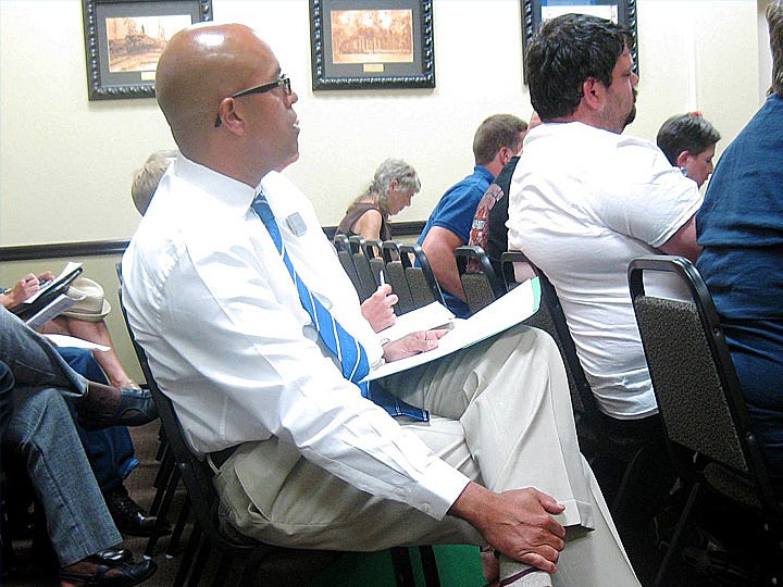 Boys and Girls Club of the Emerald Coast CEO Shervin Rassa prepares to address the Crestview City Council regarding the club's plan for an after-school program in Allen Park.