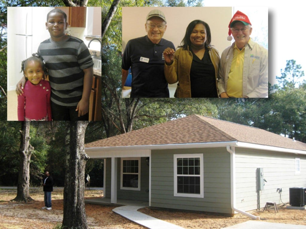 Left, David Robinson, 10, hugs his little sister Jaelah, 4, in their new kitchen. Right: ChanDrieka Robinson — pictured with construction managers Bob Hauge and Bill Prescott — displays the keys to her new home, seen below.