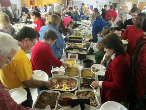 Area residents attend a Laurel Hill Harvest Supper. The annual event is hosted among several of the town's churches.