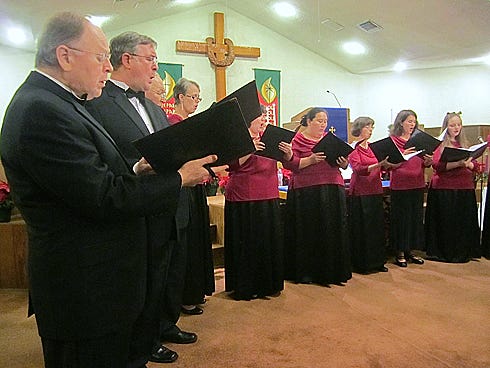 Members of Schola Cantorum (Latin for “school of singing”) perform one of their 2012 Christmas concerts at First Presbyterian Church of Crestview.