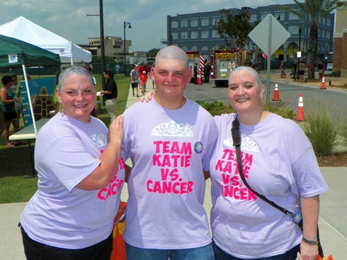 From the left, Crestview's Gretl Stenske, her son, Zac, and Fort Walton Beach resident Kim Luckie show off their shaved heads.