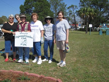 Members of the Dogwood Garden Club pause a moment after planting a flowerbed in Triangle Park, which will be renamed for the club. From left are Ruth Herington, Thea Duhaime, Sarah Petty, Eva Fountain, Mary Foresman and Celia Broadhead.