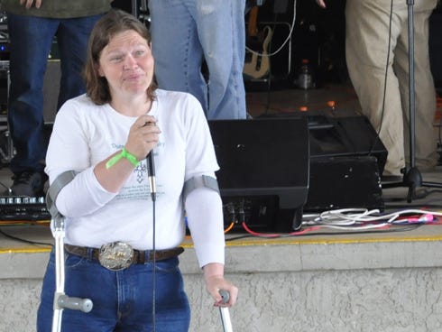 Holt resident Elizabeth Klabuhn shares her testimony on Saturday during the Rise and Unite Music Festival at Old Spanish Trail Park in Crestview.