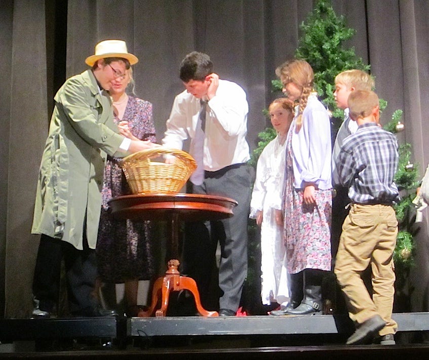 It took awhile, but George Bailey (Ryan Vance, center) realizes "It's a Wonderful Life," now playing at Crestview High School.