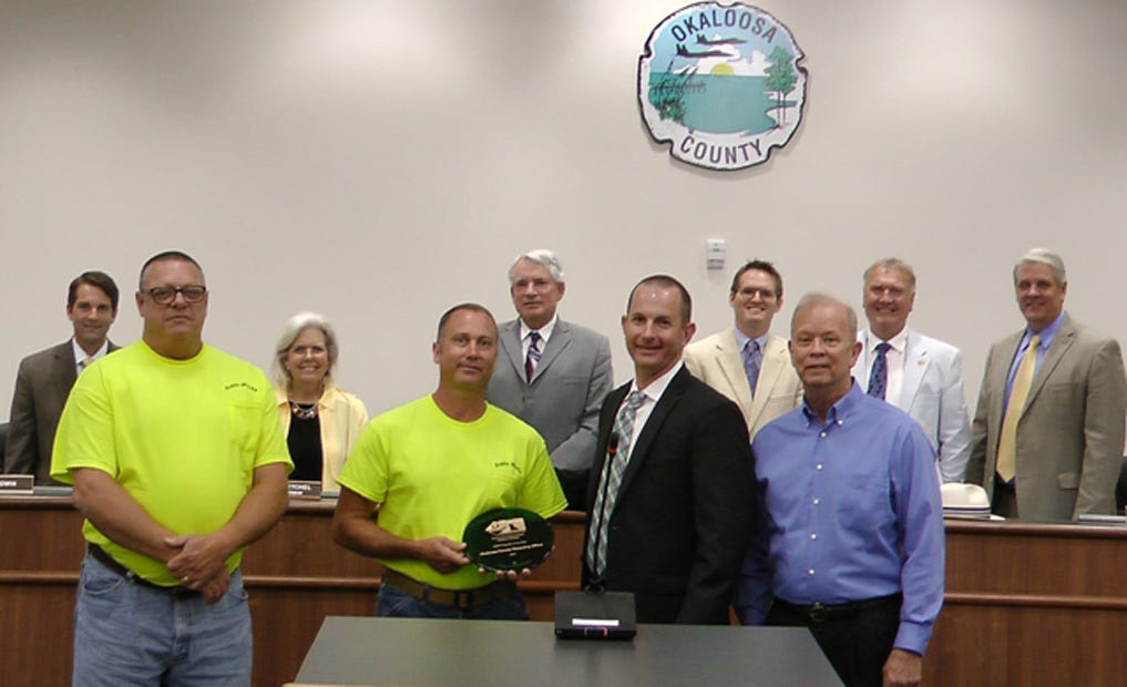 The Okaloosa Board of County Commissioners recognized Public Works-Recycling employees for receiving the Household Hazardous Waste Program of the Year Award. Back row, from left: Commissioners Trey Goodwin, Vice Chairwoman Carolyn Ketchel, Chairman Kelly Windes, Nathan Boyles, Wayne Harris and County Administrator John Hofstad. Award recipients recognized are, front row, from left: Chauncey King, Hazardous Materials Technician I; Jay Shartz, Hazardous Material Technician II; Public Works Director Jason Autrey; and Recycling Coordinator Jim Reece.