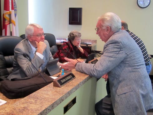 City attorney Jerry Miller, left, chats with land use and zoning consultant Jack Dorman following a workshop called Monday evening to discuss zoning revisions.