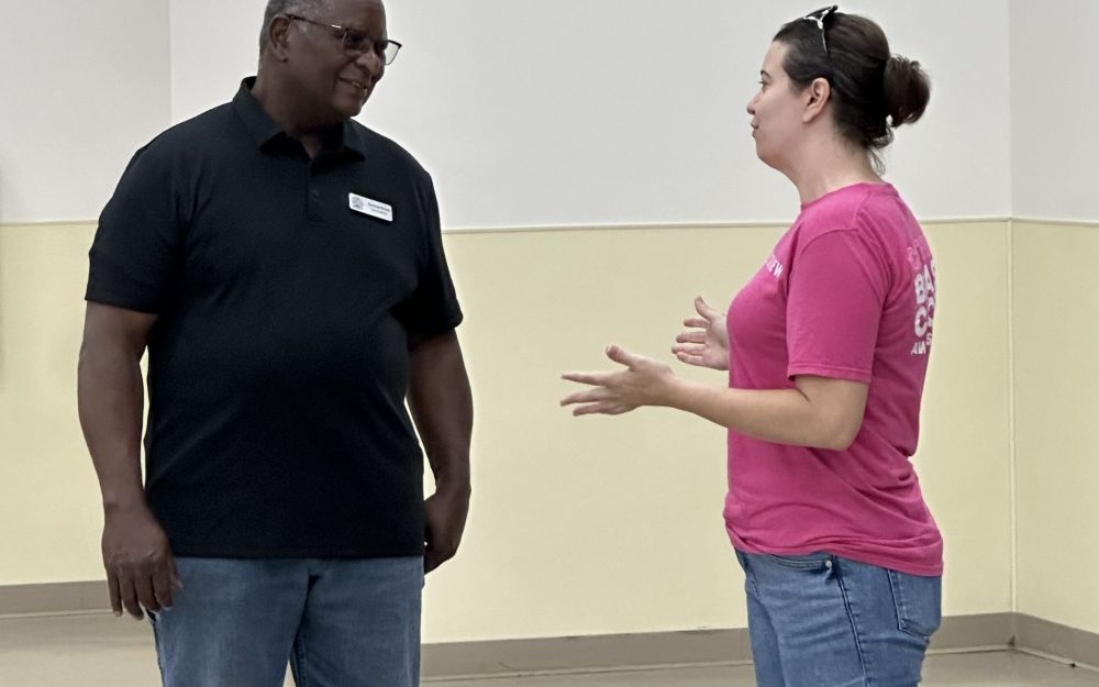 Jessica Leavins speaks with Precinct 2 Councilman Sylvester Echols