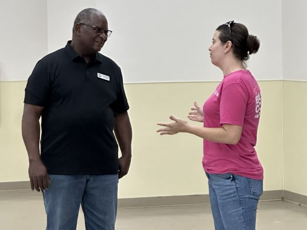 Jessica Leavins speaks with Precinct 2 Councilman Sylvester Echols